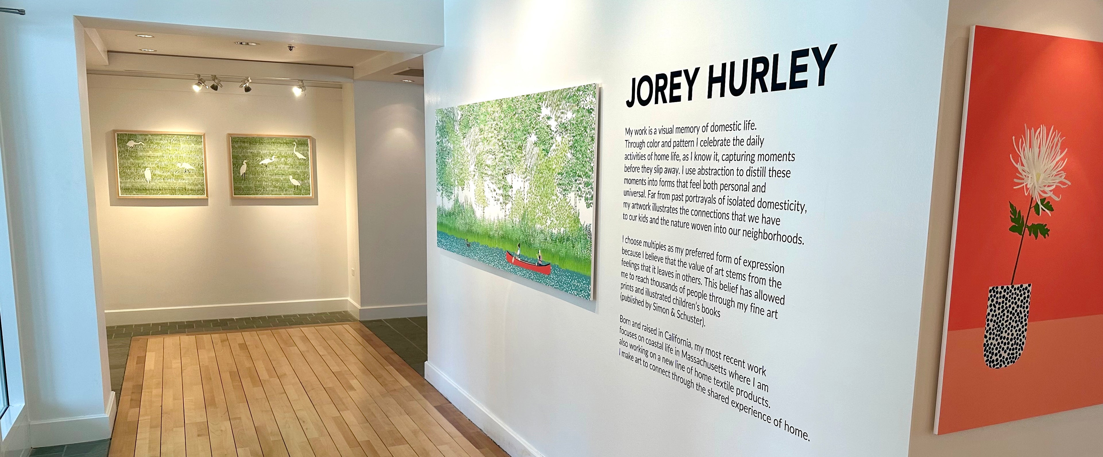 Art gallery interior with artworks on the wall and a display about Jorey Hurley.